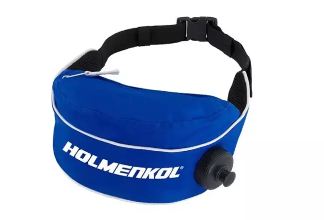 Поясная термосумка Racing Bottle Bag с удобным клапаном отлично подойдет для лыжных тренировок.  Предусмотрено дополнительное верхнее отделение на молнии для хранения аксессуаров.  Термосумка сохраняет тепло от 1 часа при температуре ниже -20 С и до 3 часов при температуре от +5 С до -10 С.  Ее также можно использовать летом, чтобы наливать охлажденные жидкости.  Объем: 1 л.